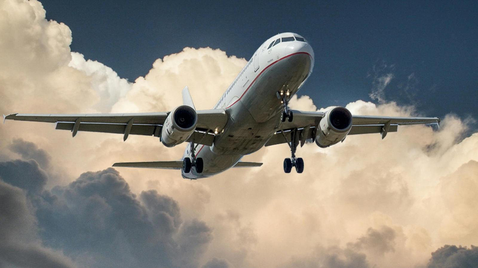 white airplane starting arrive